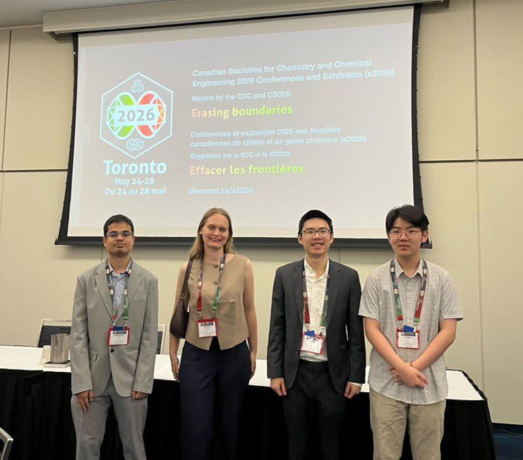 Four CSChE U of T members in front of the x2026 welcome slide