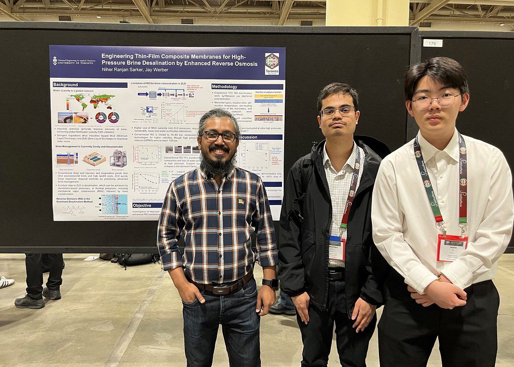 PhD student Niher Ranjan Sarkar with CSChE members at his research poster